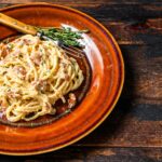Italian Spaghetti Carbonara pasta with bacon, hard parmesan cheese and cream sauce.