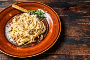 Italian Spaghetti Carbonara pasta with bacon, hard parmesan cheese and cream sauce.