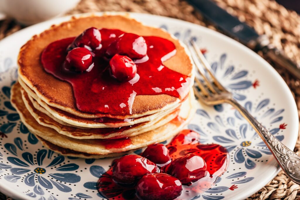 Stack of pancakes with dogwood berry marmalade